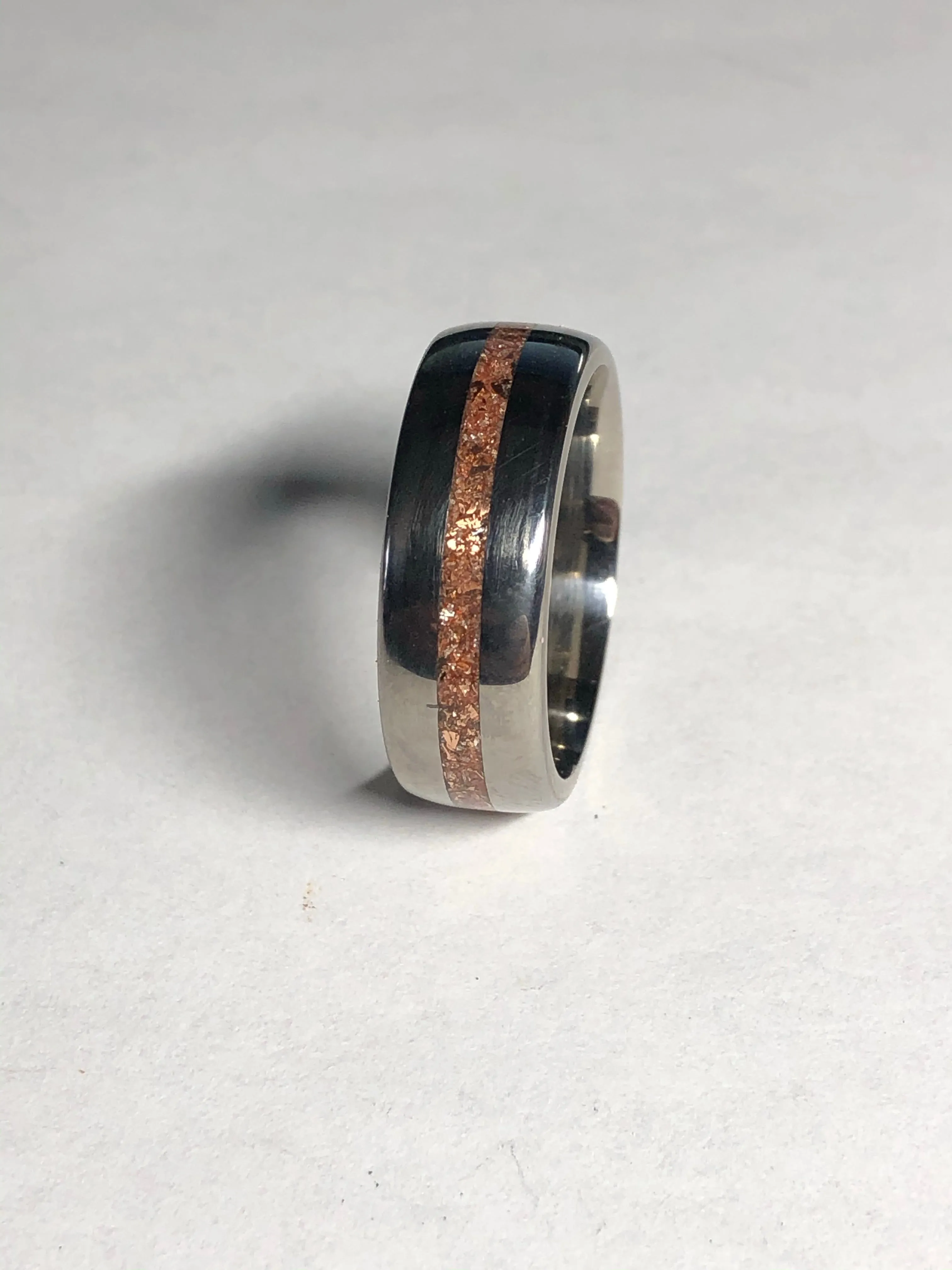 Titanium with gold stone inlay