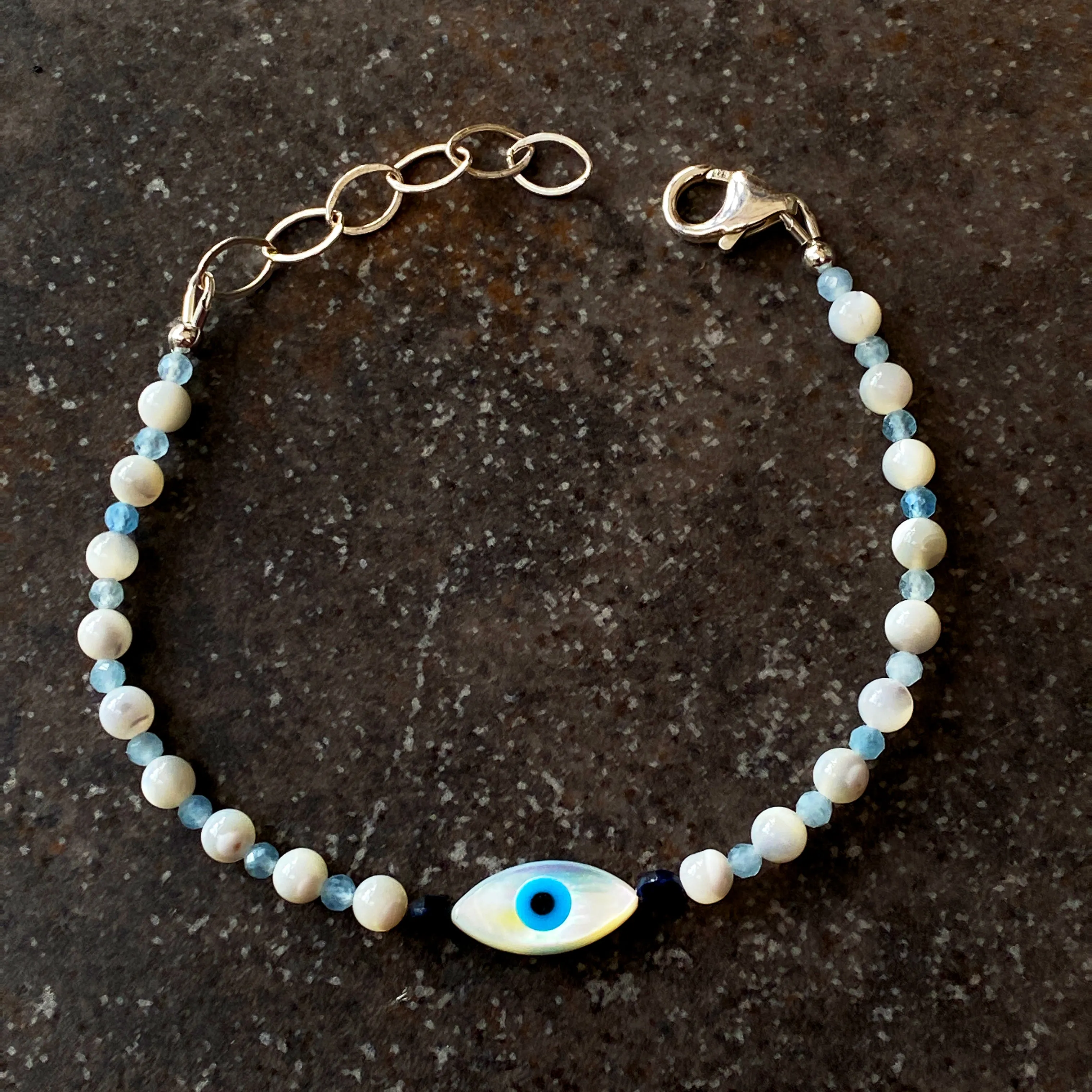 Women's mother of pearl, Blue Sapphire, and Aquamarine Evil Eye Gemstone silver Clasp Bracelet
